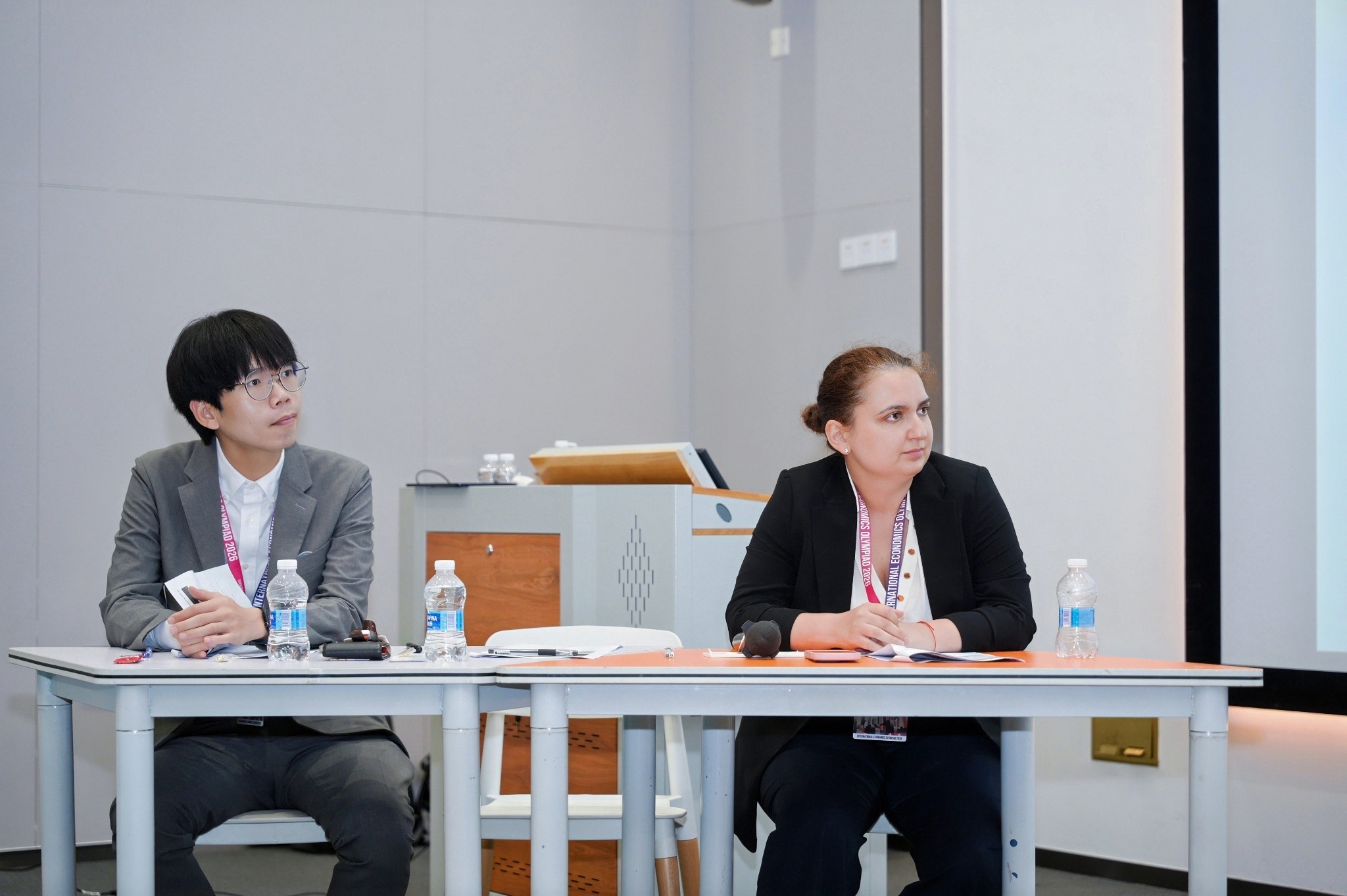 Panel members listening to a presentation at the 2026 forum
