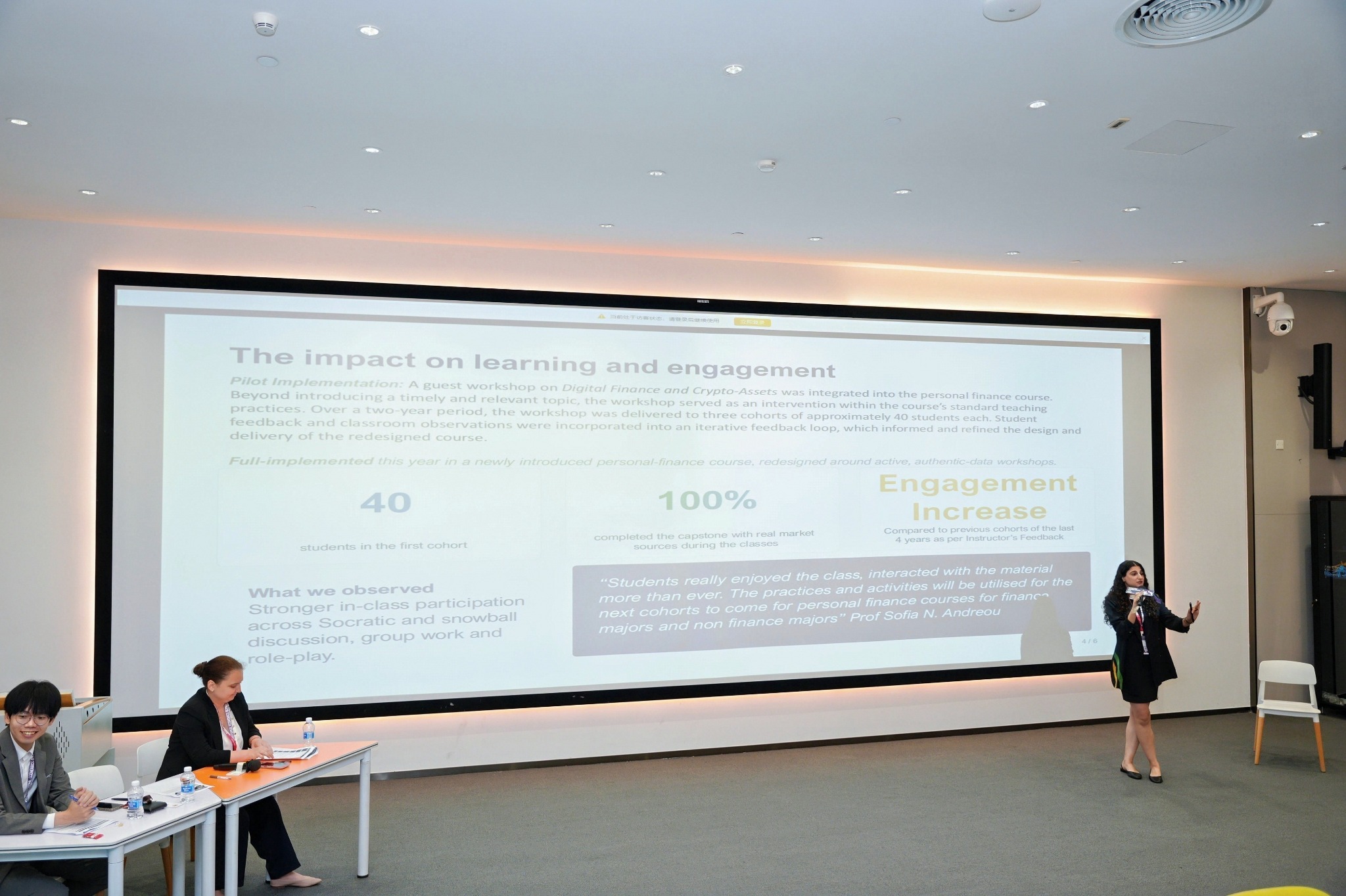 Educator presenting to the forum during IEO 2026